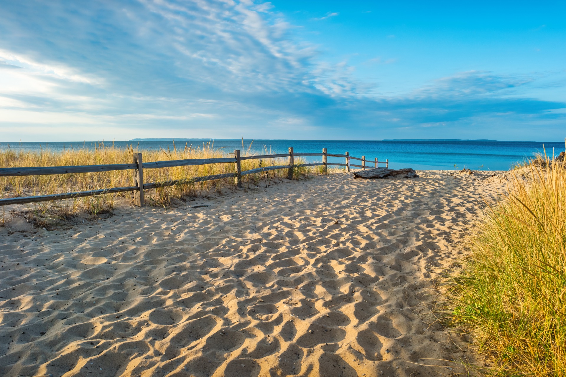 The sandy path to the beach at Glen Arbor, blue water beyond